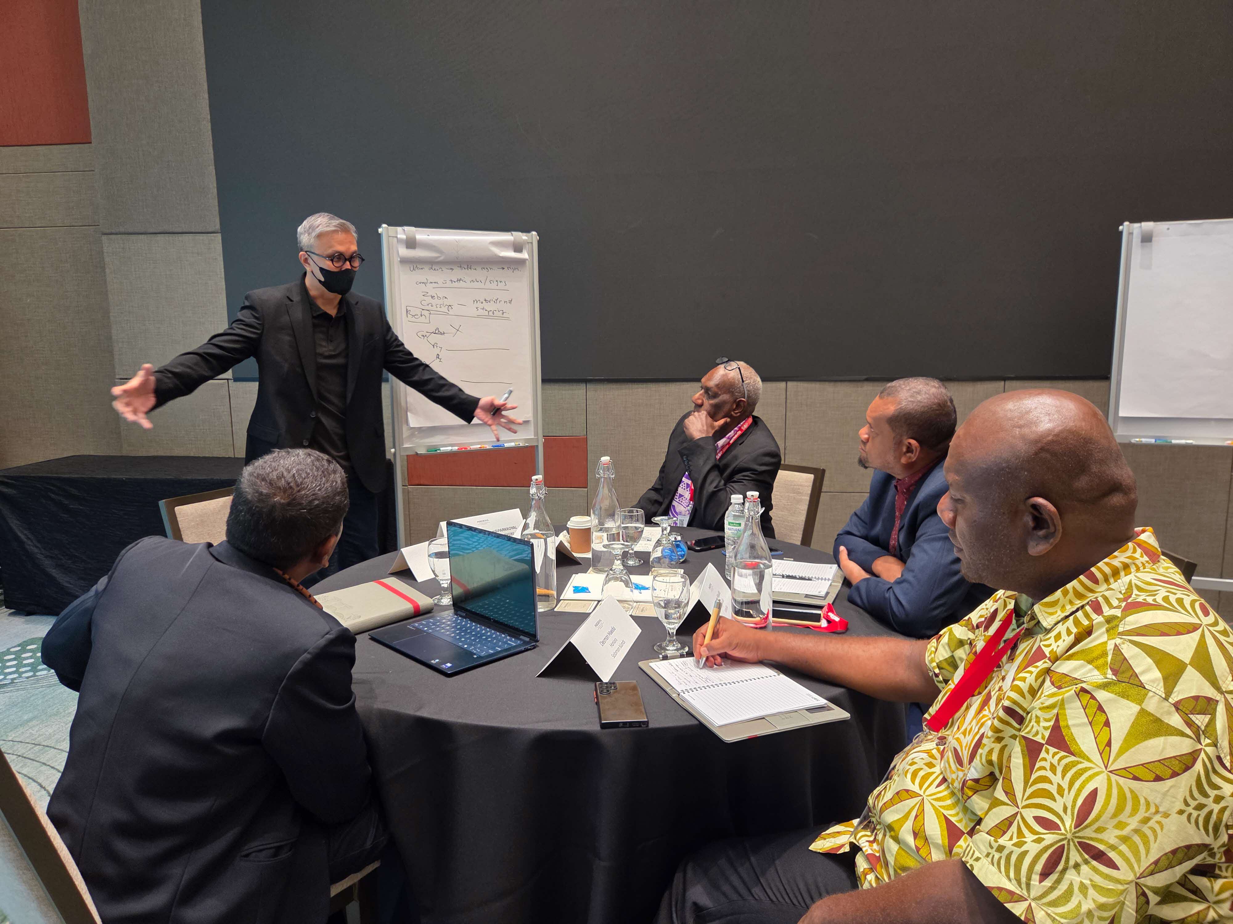 Participants from Vanuatu and Solomon Islands brainstorming ideas during the Behavioral Insights Workshop conducted by Temasek Polytechnic